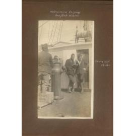 Helmsman keeping his feet warm on the Terra Nova, showing Cherry and Drake