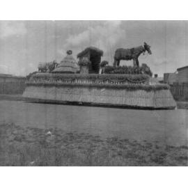75th Procession float with straw horse, house and hay stack, 1938