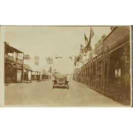 Beardy Street, from Imperial Hotel, with motor car and flags, [1918]