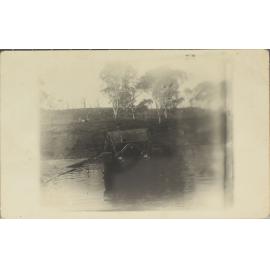 Car crossing flooded creek