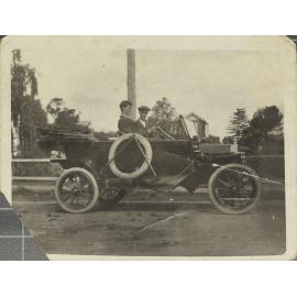 Two men in motor car