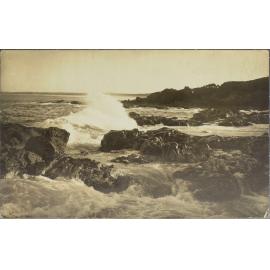 Waves crashing on rocks, coastal scene
