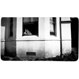 Hec Shaw at window of "Whare Koa" student residence, Armidale Teachers' College, 1930