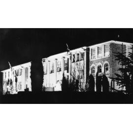 Armidale Teachers' College, building illuminated for celebration of UNE's autonomy, 1955