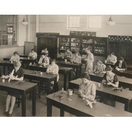 Armidale Teachers' College students painting aeroplane models, 1941