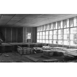 Armidale Teachers' College - Construction of Newling House, 1954 - corner of dining room, used for assembling materials and fittings
