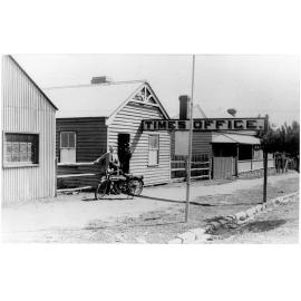 Uralla Times Office, Roy S. Vincent in dust coat near his bike
