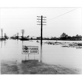 Flooded creek, looking west along Beardy Street from Jessie Street intersection, 1970