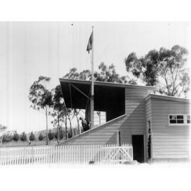 Armidale Teachers' College: Hoisting the flag at the Annual Athletics Carnival, Oxford Pavilion, 1935