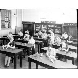 Armidale Teachers' College, H.W. Oxford painting aircraft models with women students, 1941