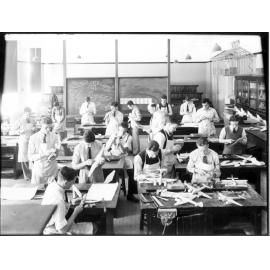 Armidale Teachers' College, H.W. Oxford with students making aircraft models, 1941
