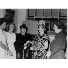 Armidale Teachers' College: Lady McKell receives a bouquet in the Library, 1949