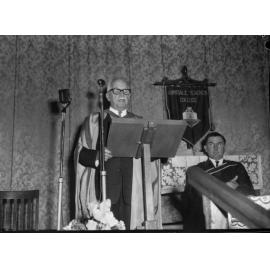 Dr C.B. Newling giving the Occasional Address at the Armidale Teachers' College graduation ceremony, 1964
