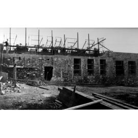 Armidale Teachers' College building under construction - window frames being inserted, 1928