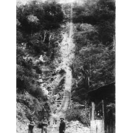 West Sunlight Tramway, Metz. Group of miners and ore cart at bottom of Baker's Creek Gorge.