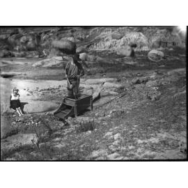 Gold mining at Rocky River using a cradle