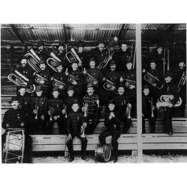 McMahon's Brass Band in full uniform in grandstand