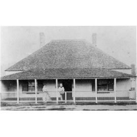 Dr William Sheldon and Mrs Sheldon on the verandah of their home,  c. early 1872.