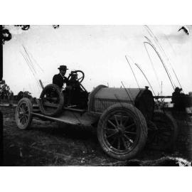 C.A. Bruce, the youngest of two people in the car, 1914