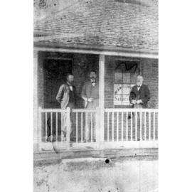 Group on verandah of the original A.W. Simpson, Solicitors, building in Faulkner Street, Armidale