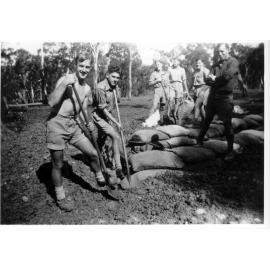 Digging slit trenches north of Booth Block, New England University College