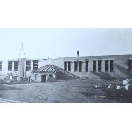 Man standing on top of a partially completed building, ATC
