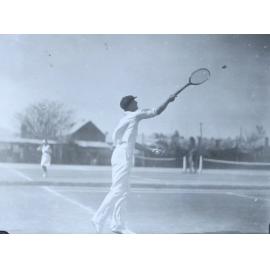 Reg Hoade playing tennis, 1931