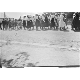 People marching along a street, [c.1919]