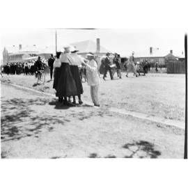 People marching along a street, [c.1919]