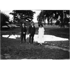 Ray Jopson, Billy Jopson, and Clare Chamberlain by an unidentified dam or billabong