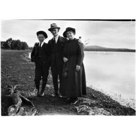 Ray Jopson, Billy Jopson, and [Dora 'Topsy' Chamberlain?] by a dam or billabong