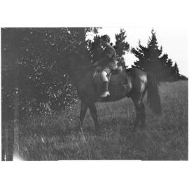 Unidentified young boy on a horse
