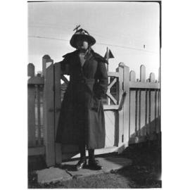 Unidentified woman at the front gate of 63 Barney Street, Armidale