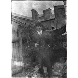 Unidentified man at the rear of Mallam's Pharmacy, Beardy Street, Armidale
